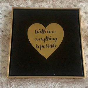 With love anything is possible sign.